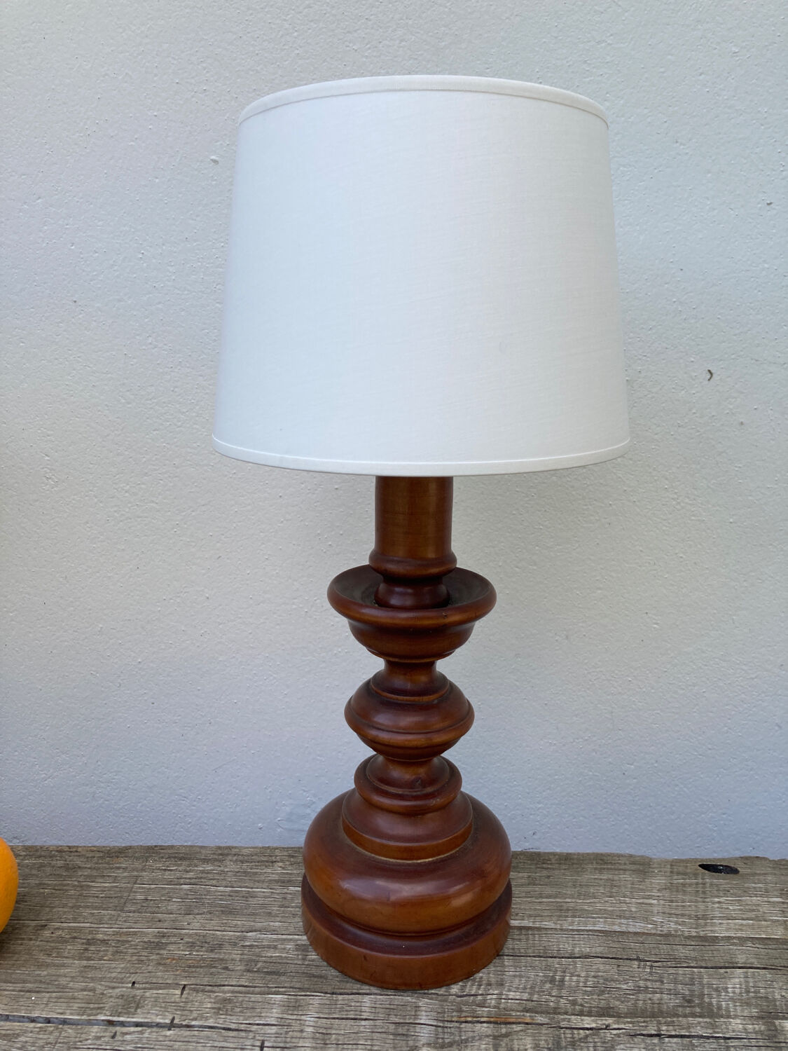 Vintage turned wooden lamp and white lampshade