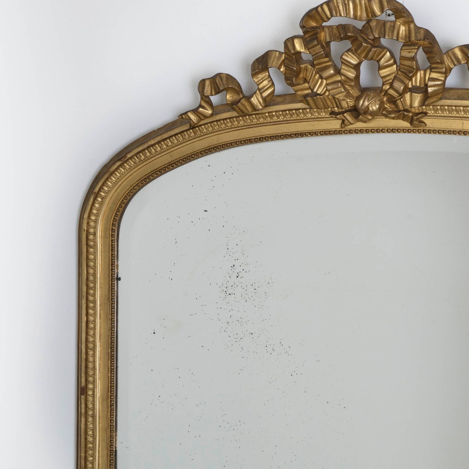 Large 19th c gilt wood bow cartouche mirror