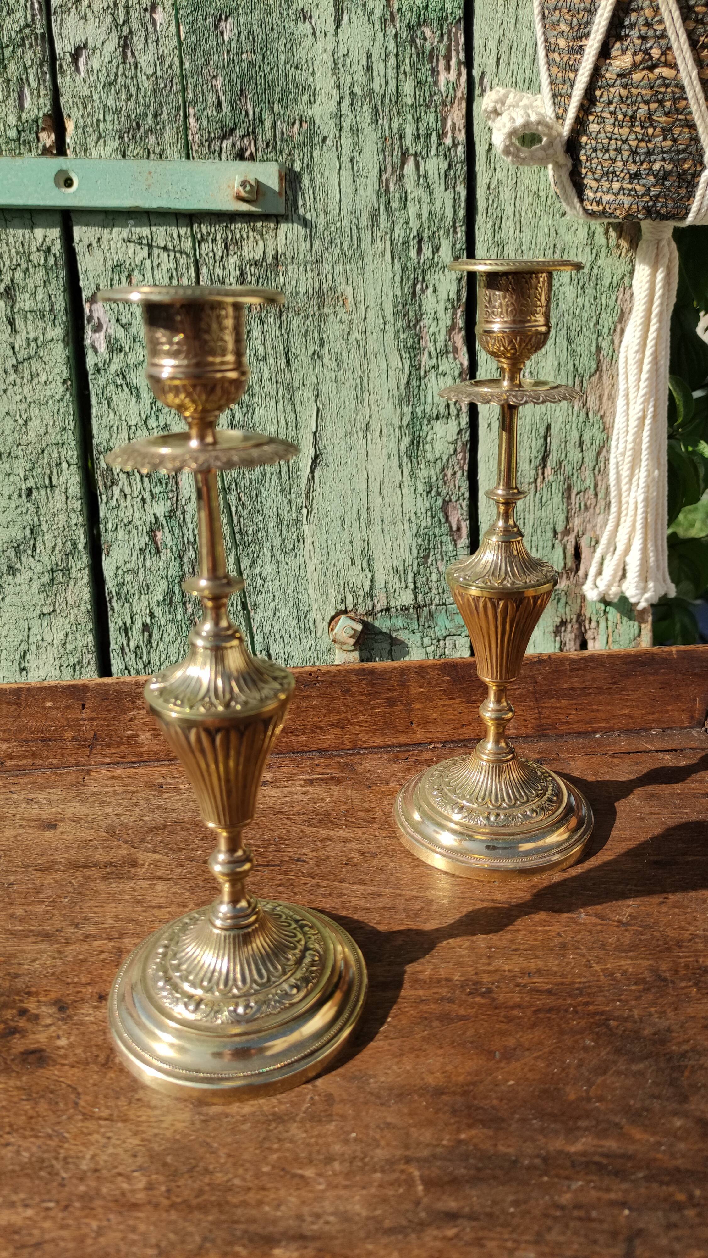 Pair of chiseled brass candle holders