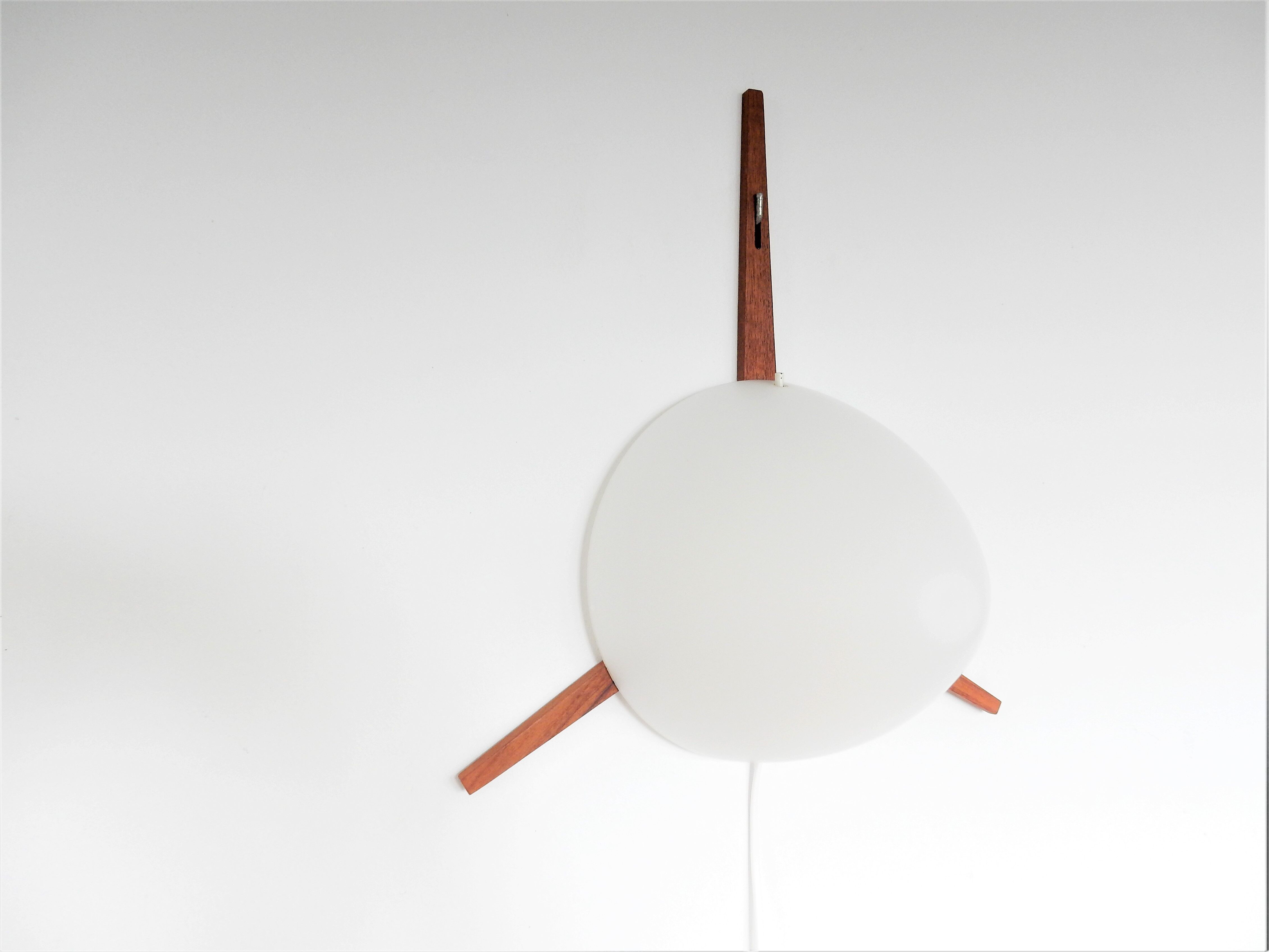 C-1575 teak and opaline glass wall lamp by Eje Ahlgren for Raak 1957