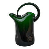 Blown glass pitcher filled
