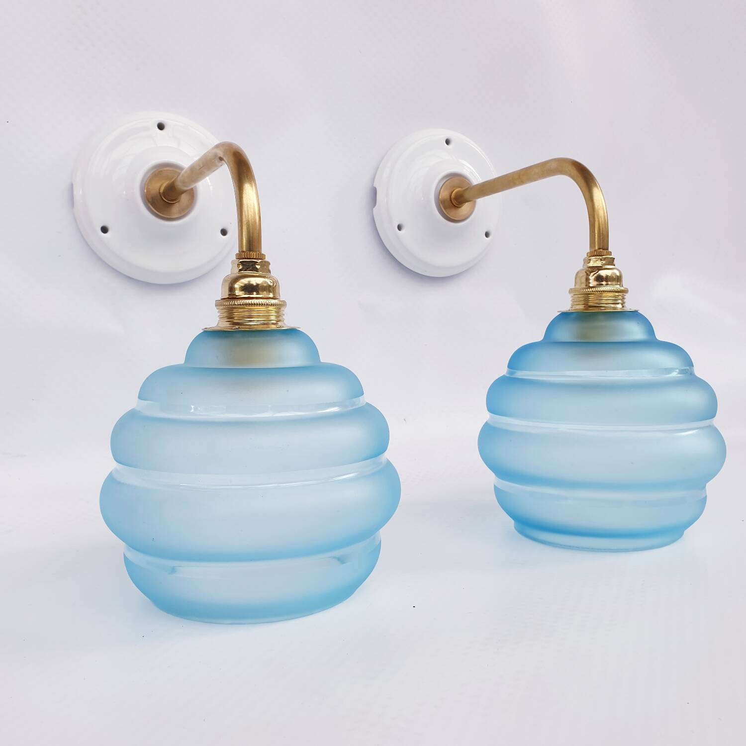 Vintage brass and blue glass wall lights