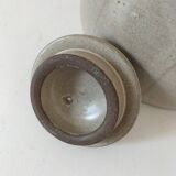 Beige stoneware teapot with stylized flowers and rattan handle