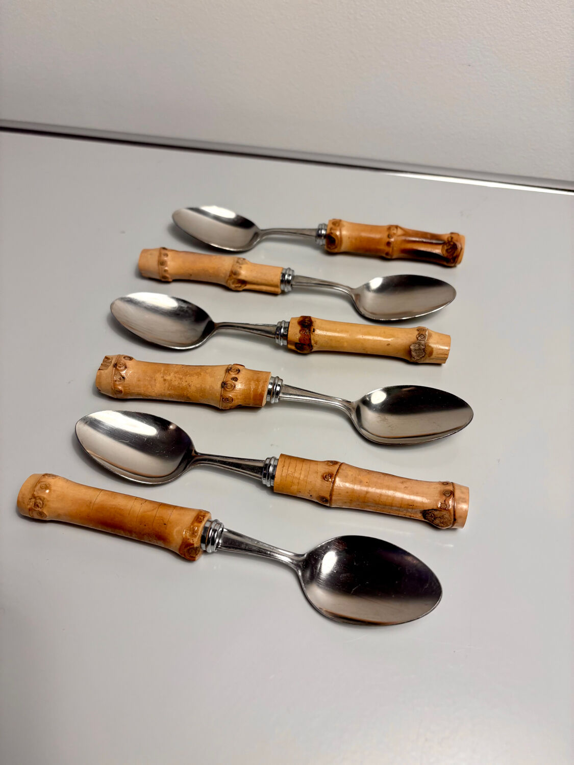 Set of 6 vintage dessert spoons with bamboo handles.