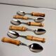 Set of 6 vintage dessert spoons with bamboo handles.