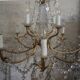 Chandelier 12 lamps with grapevines in crystal, bronze and regulated