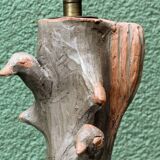 Lamp base in sculpted terracotta featuring birds, signed.