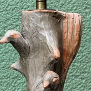 Lamp base in sculpted terracotta featuring birds, signed.