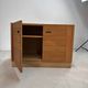 Low buffet with horizontal fronts and recessed handles in the spirit of the Regain house.