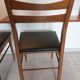 5 Scandinavian style chairs, wood and black faux leather.