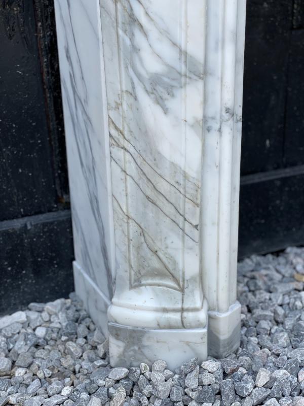 Louis XV style fireplace in white Carrara marble arabescato