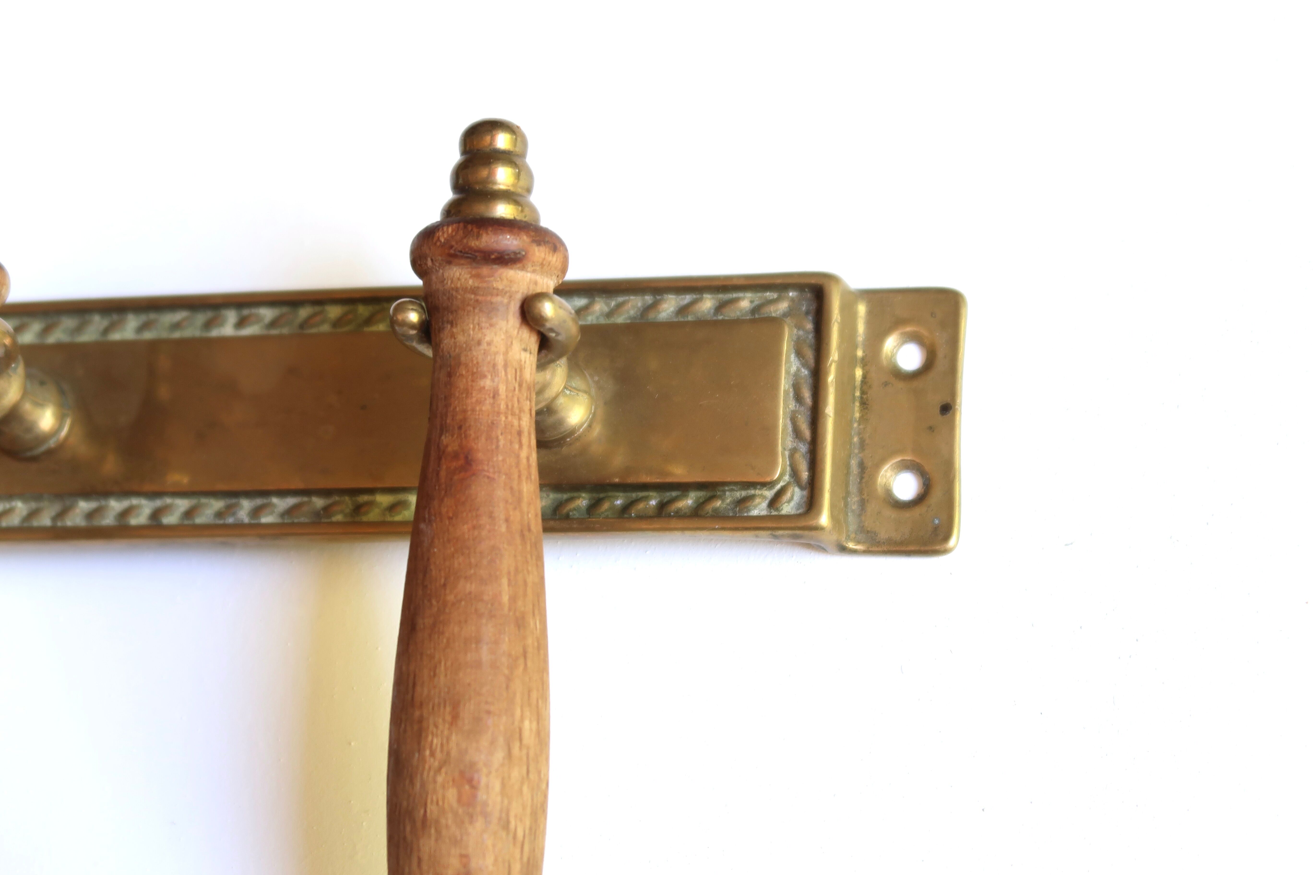 Brass and wood kitchen utensils with wall display, 60s