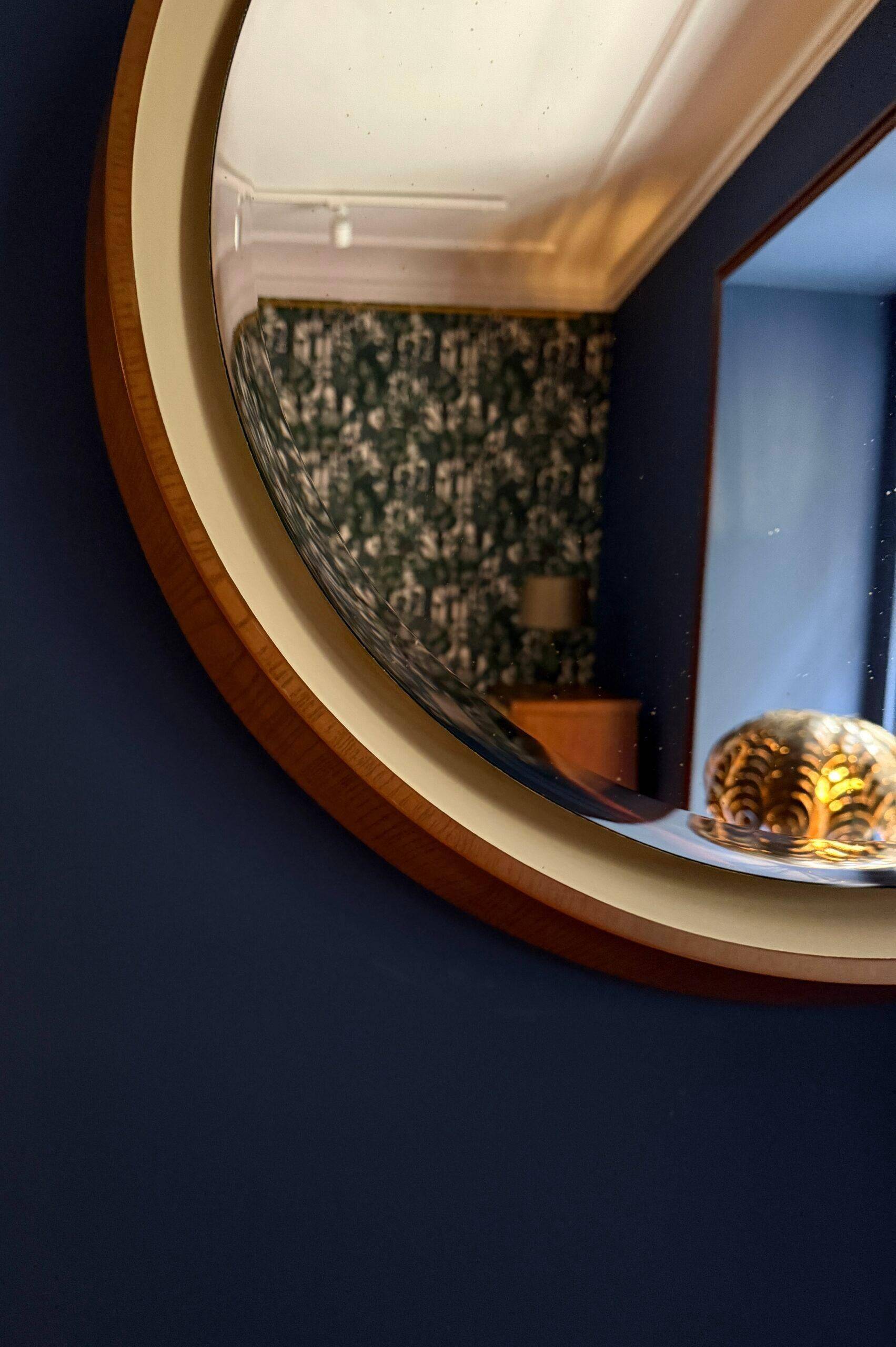 Backlit mirror designed by Gio Ponti in wood and lacquer. Italy, 1970s.