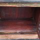 Furniture low in colorful wood. 12 drawers and 1 door