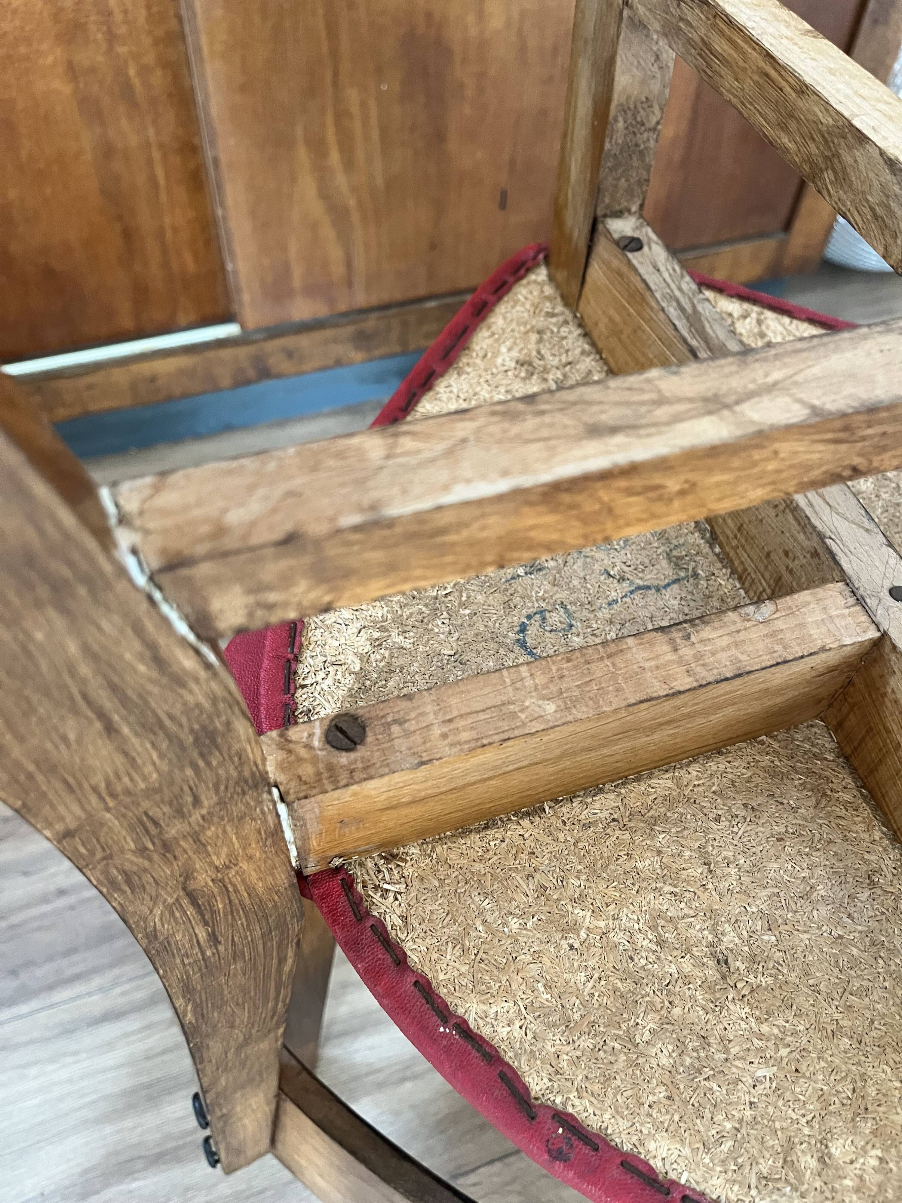 Set of 4 wooden chairs with red vinyl.