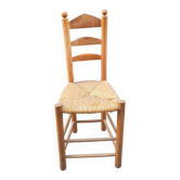 Neo-rustic chair in wood and wicker in the brutalist style by Charles Dudyoyut.
