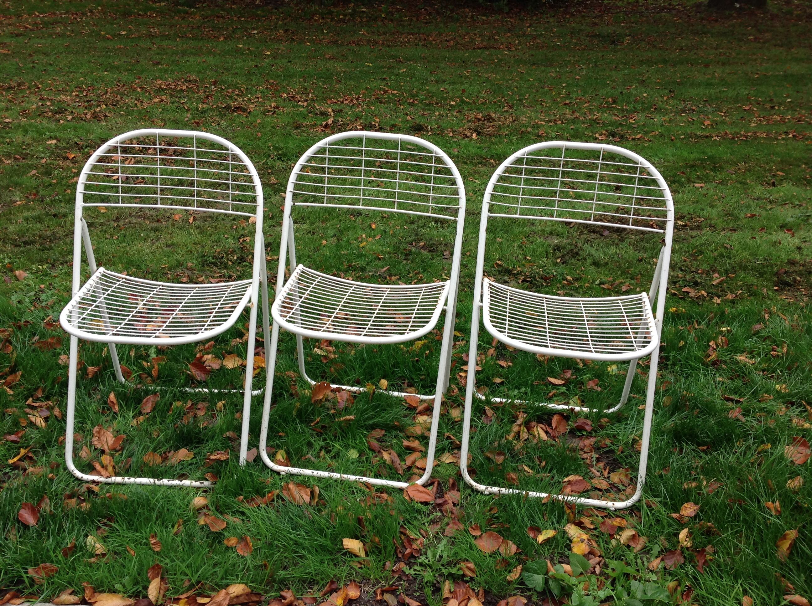 Trio of folding metal chairs