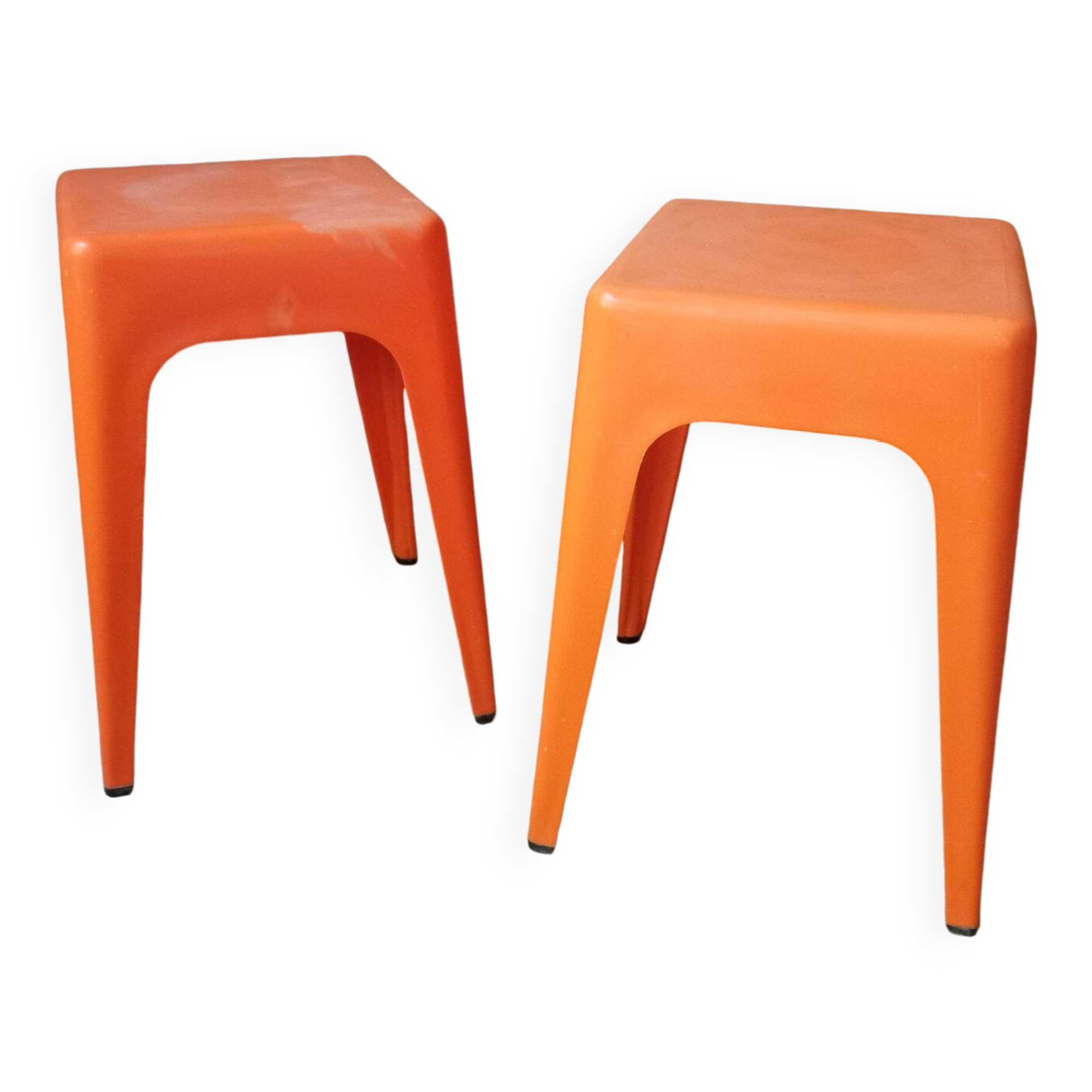 Pair of AMI stools in orange plastic