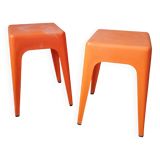 Pair of AMI stools in orange plastic