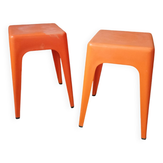 Pair of AMI stools in orange plastic