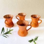 4 large orange enameled ceramic cups, signed