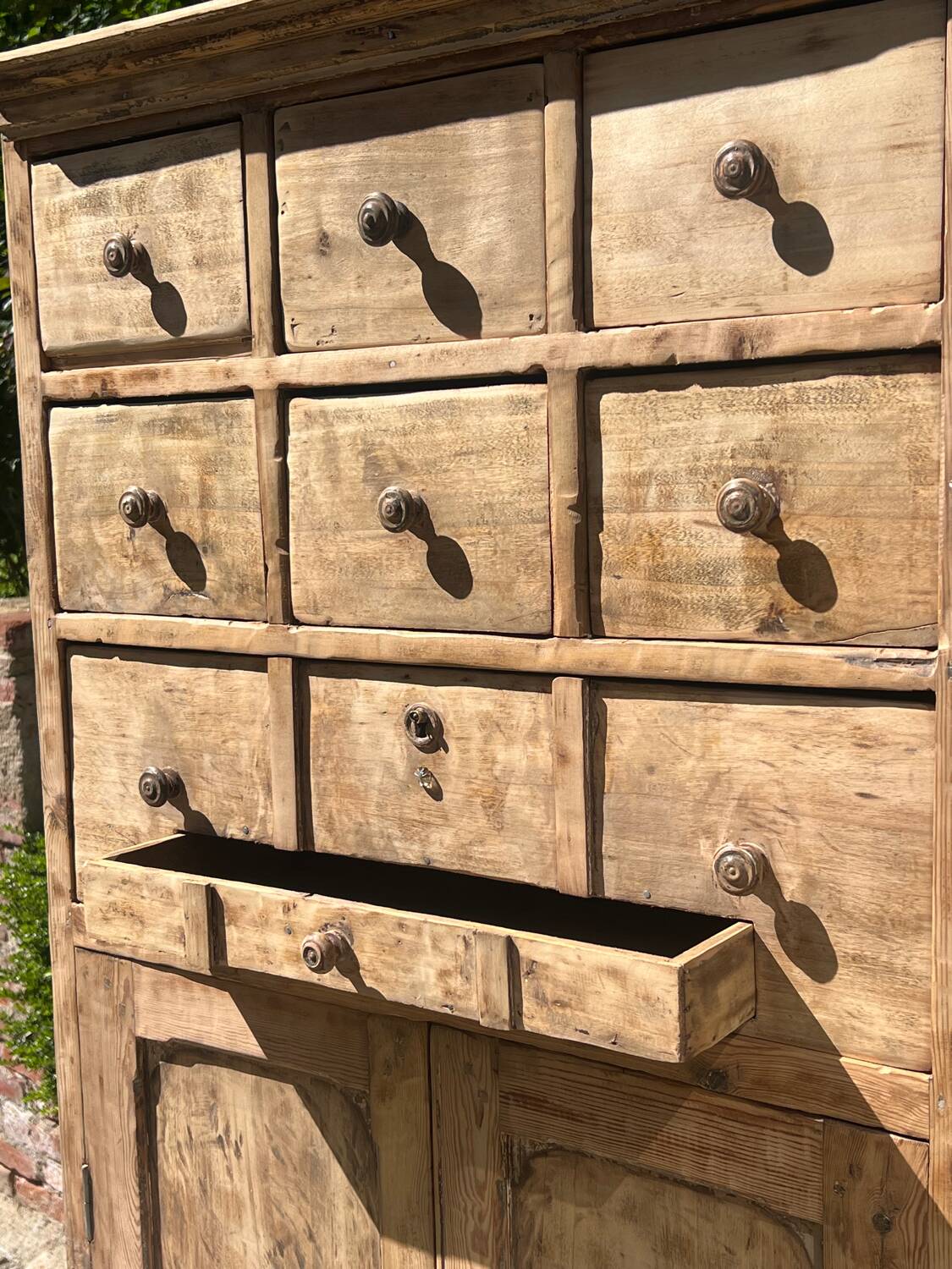 Beautiful piece of furniture with 8 drawers/2 doors in raw wood.