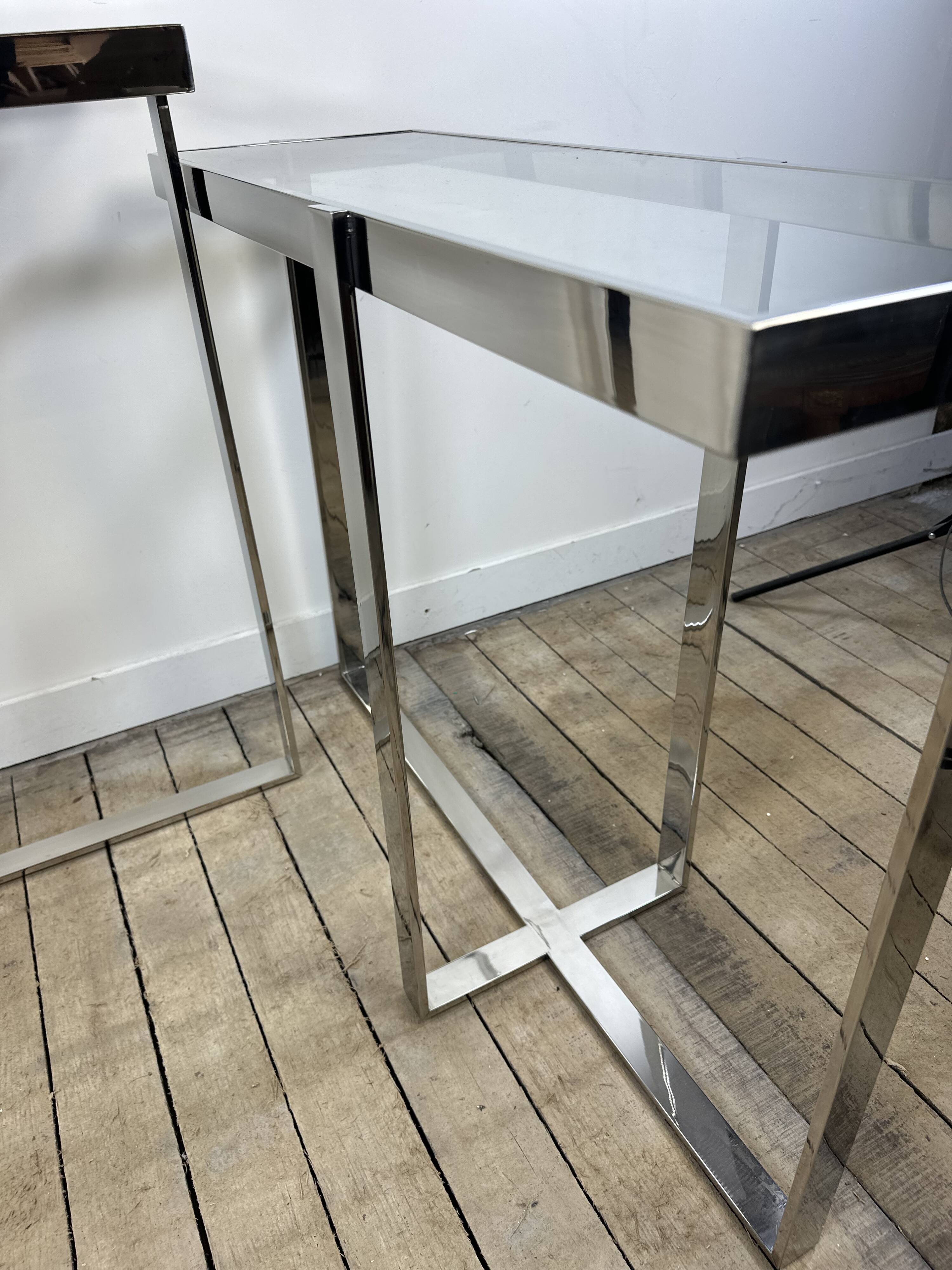 Chrome metal and glass console from the 2000s.