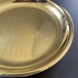 Round brass pocket tray with club and golf ball decoration.