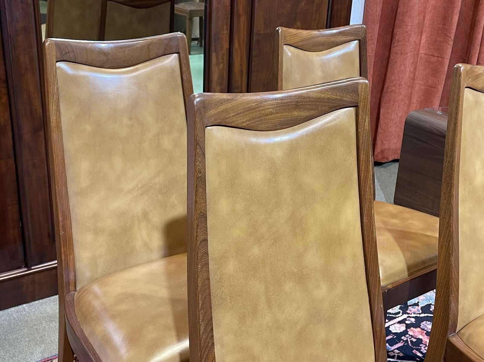 Set of 4 G-Plan chairs in teak and faux leather from the 1970s.