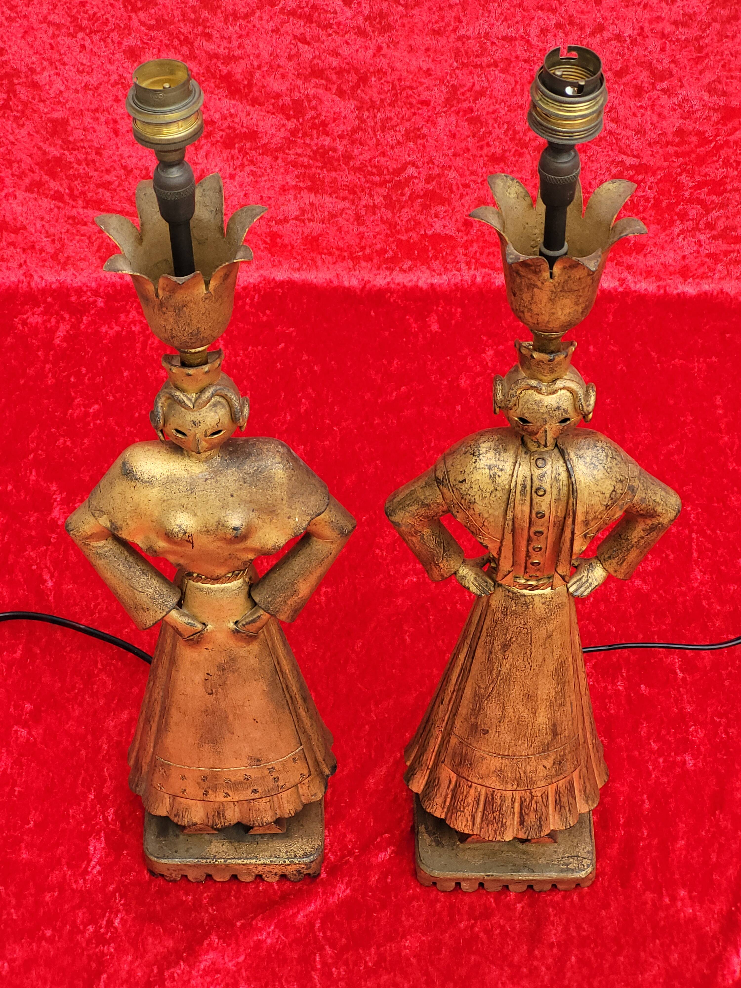 Pair of gilded beaten iron sculpture lamps attributed to Gilbert Poillerat