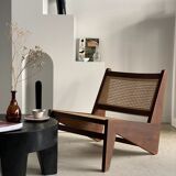 Reclined armchair in canned teak in natural wood
