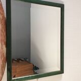 Beveled mirror and varnished wooden frame