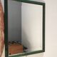 Beveled mirror and varnished wooden frame