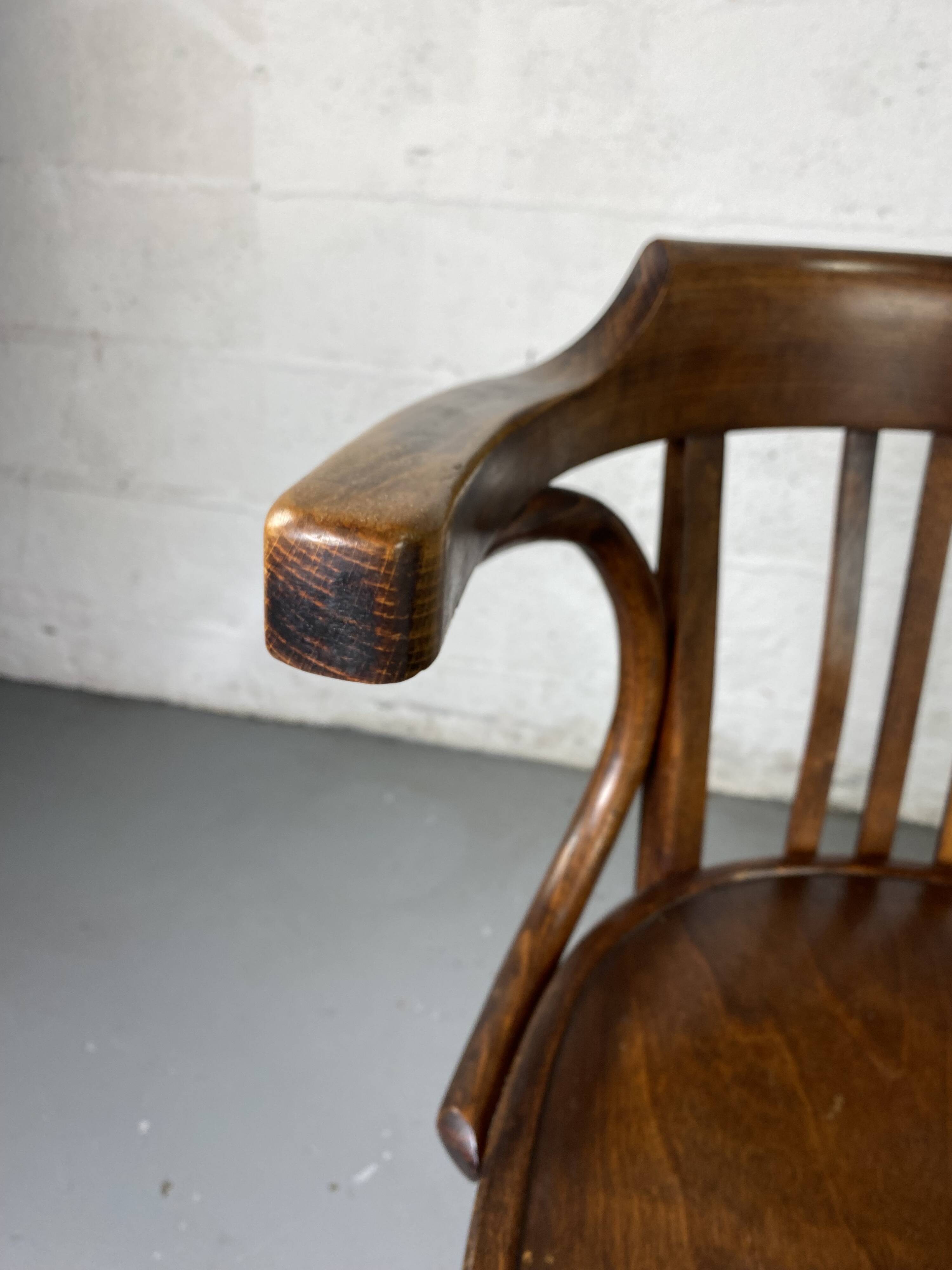 Baumann rotating wooden armchair