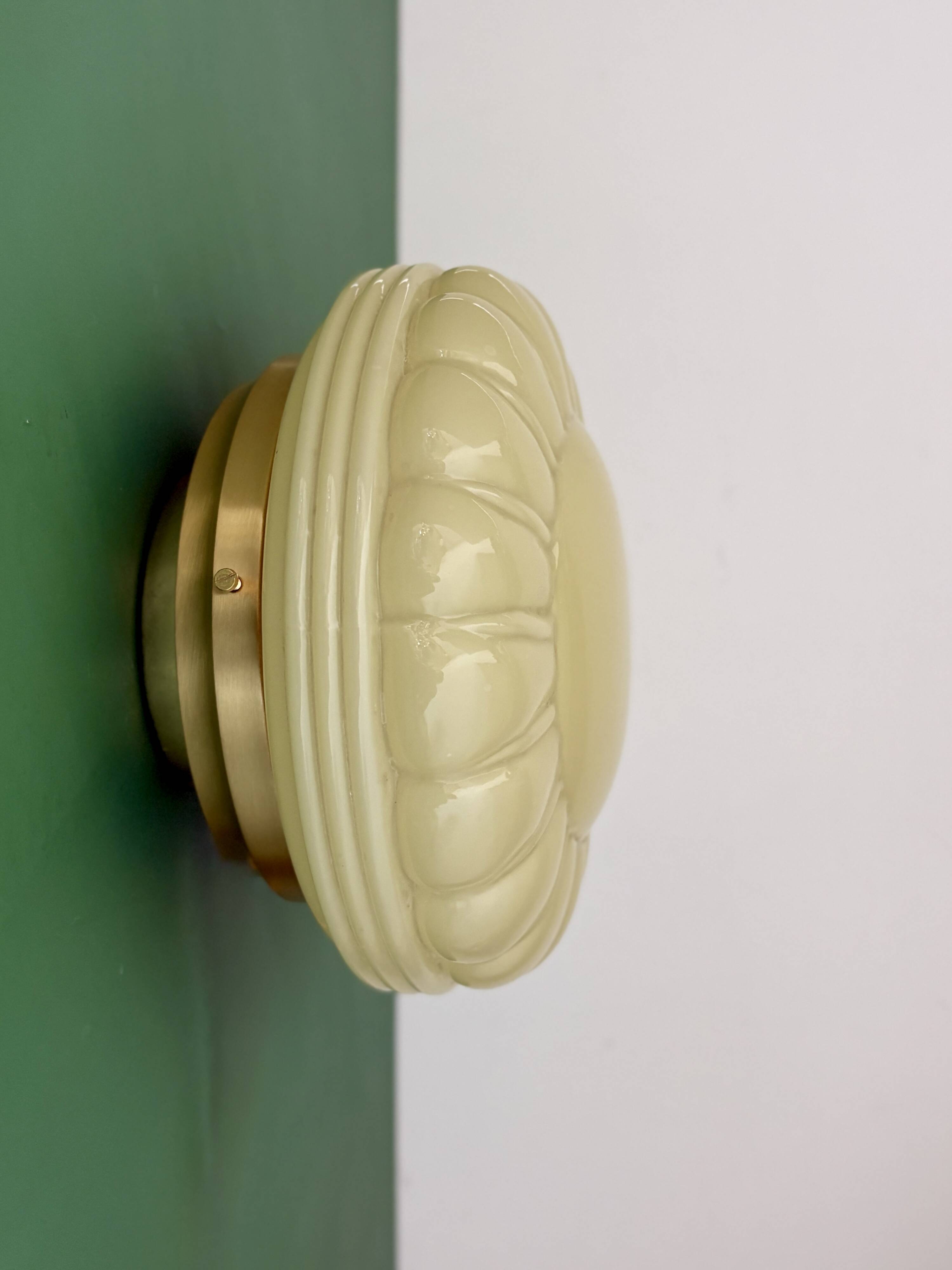 Vintage Art Deco globe wall or ceiling light in yellow opaline.