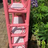 Pink rattan shelf