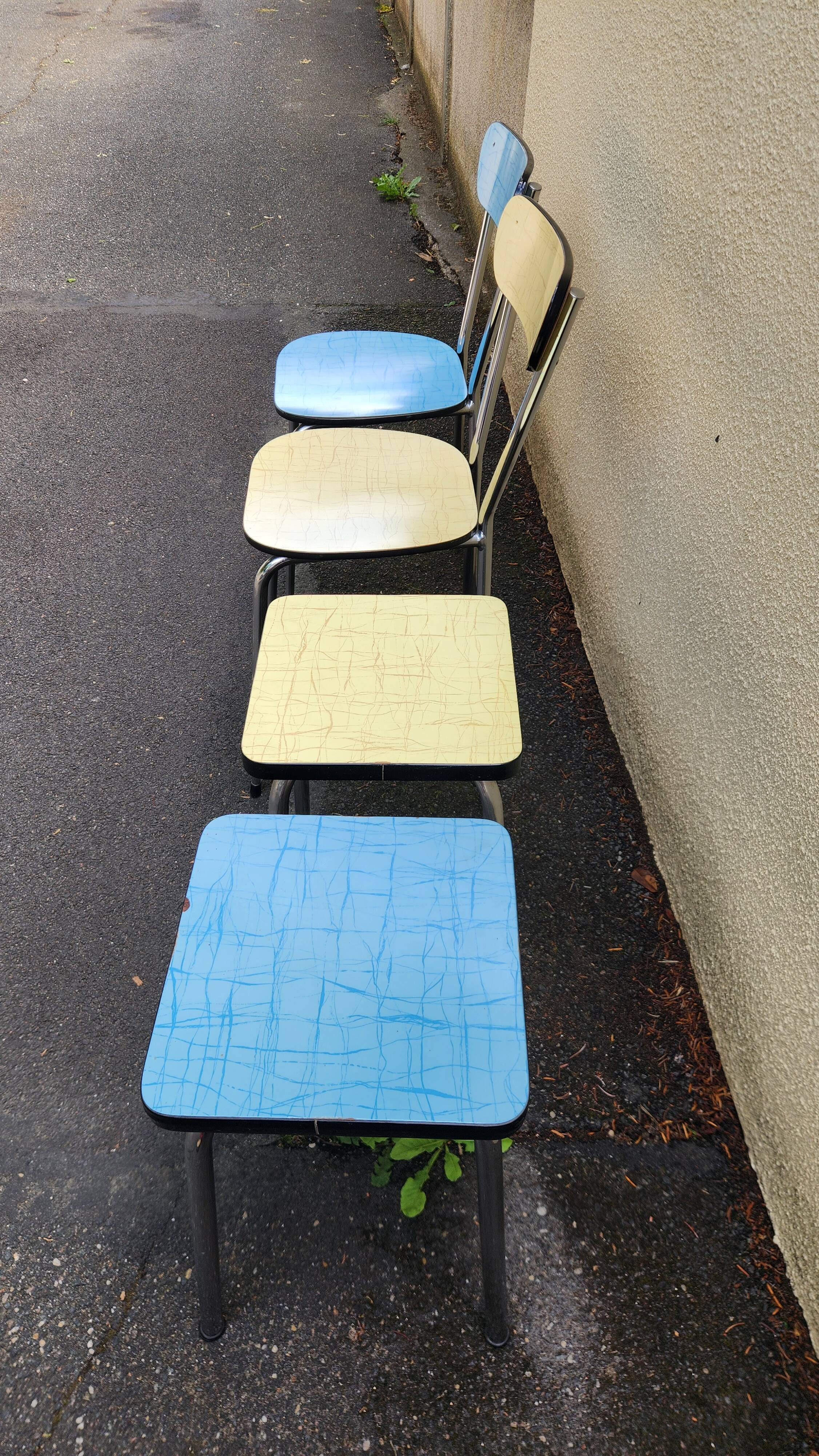 Vintage set from the 60s/70s: table, chairs, and marbled Formica stools.