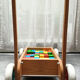 Walking trolley with multicolored wooden cubes
