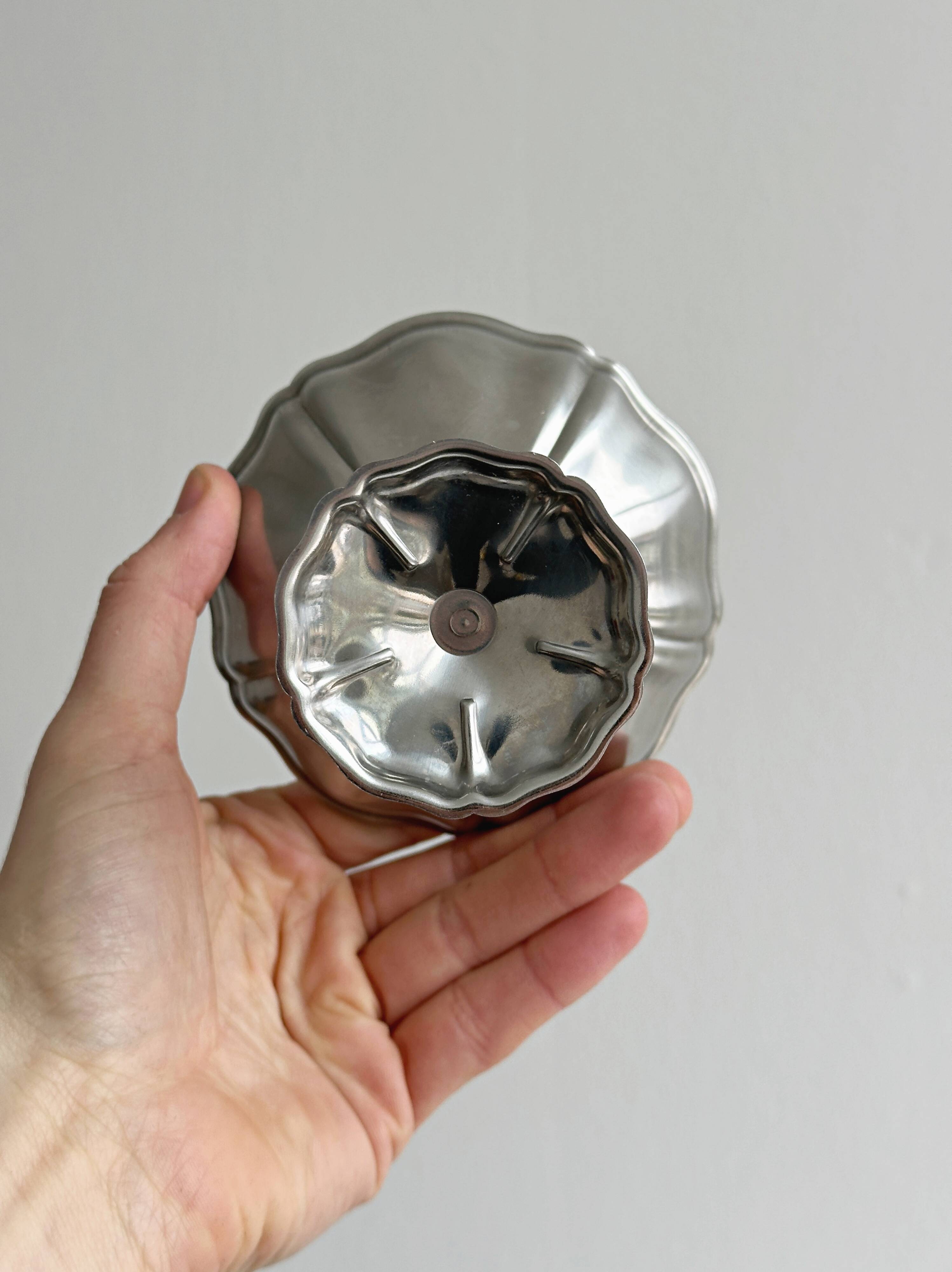 8 very large stainless steel footed bowls