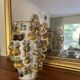Large antique vase with relief decorations of coloured fruits.