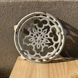 Old trivet in enameled cast iron round format white vintage tableware
