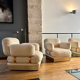 Pair of armchairs by Thibier in brass and wool France 1978