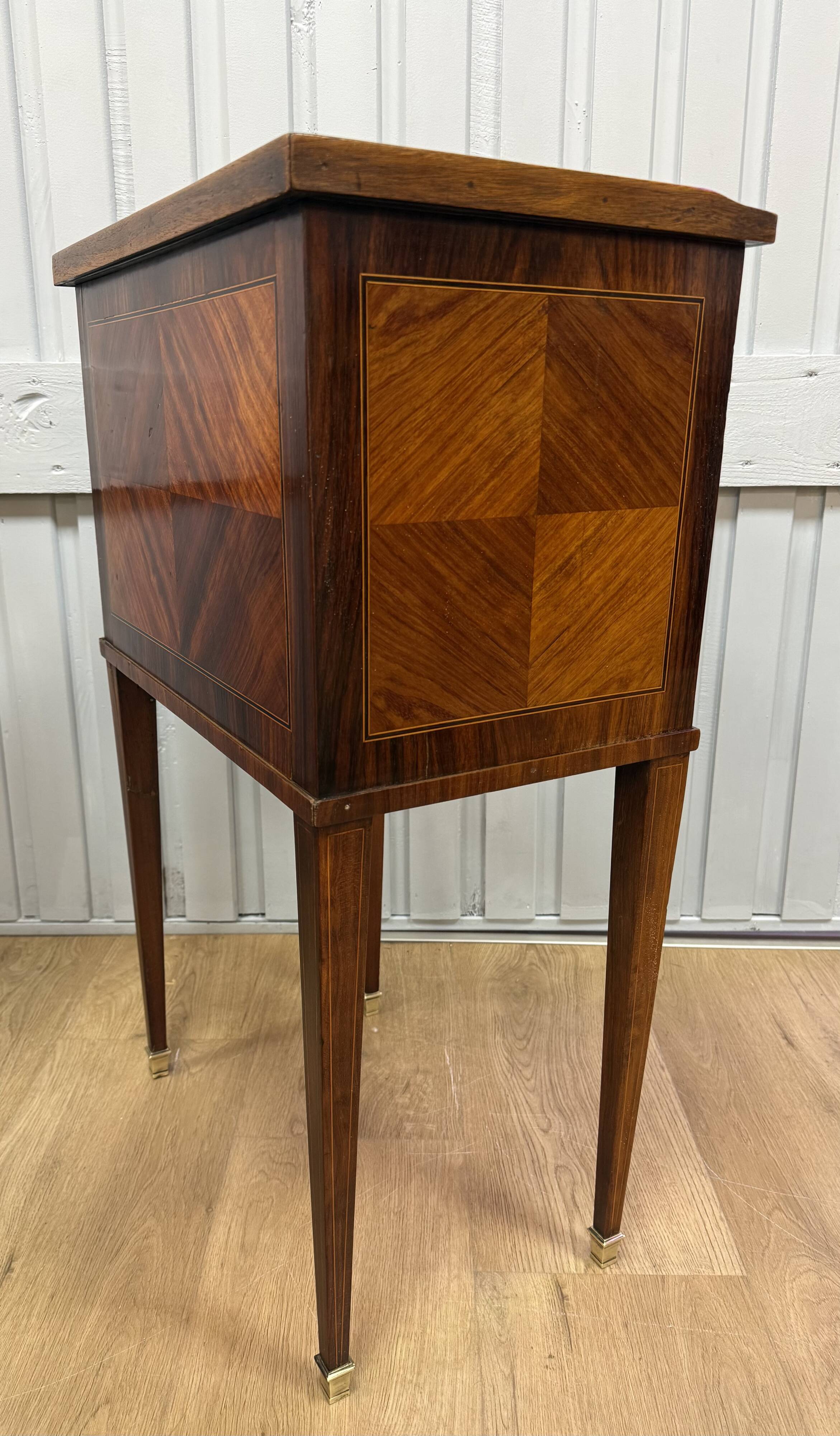 Side table with a faux book front.