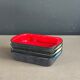 Set of 4 enamelled cast iron dishes/platters.