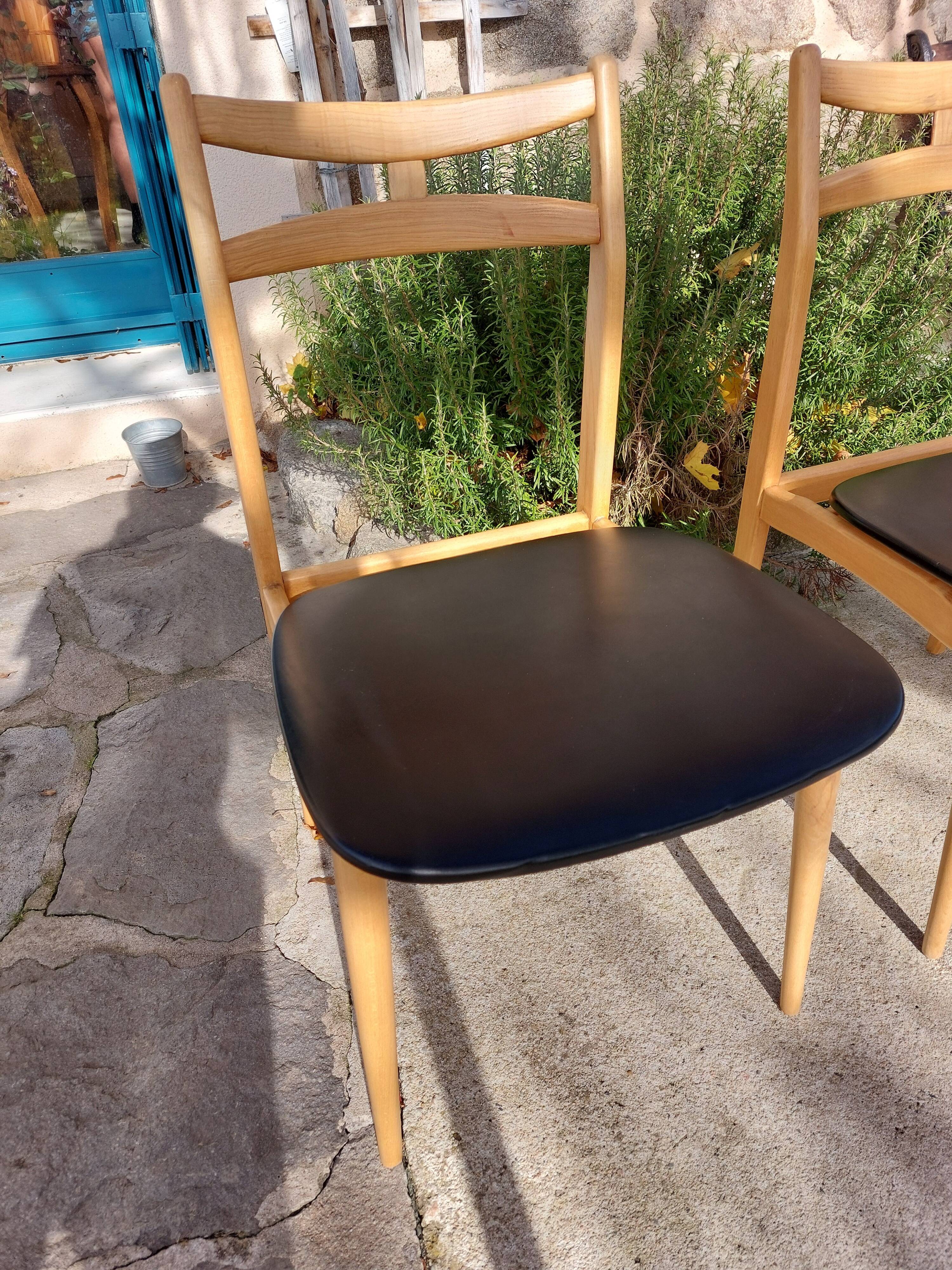 3 Scandinavian-style chairs, light wood and black faux leather