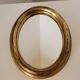 Miroir ovale cadre en bois doré 22 X 17 X 2 cm.