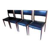 Four antique Scandinavian-style chairs made of solid wood and faux leather.