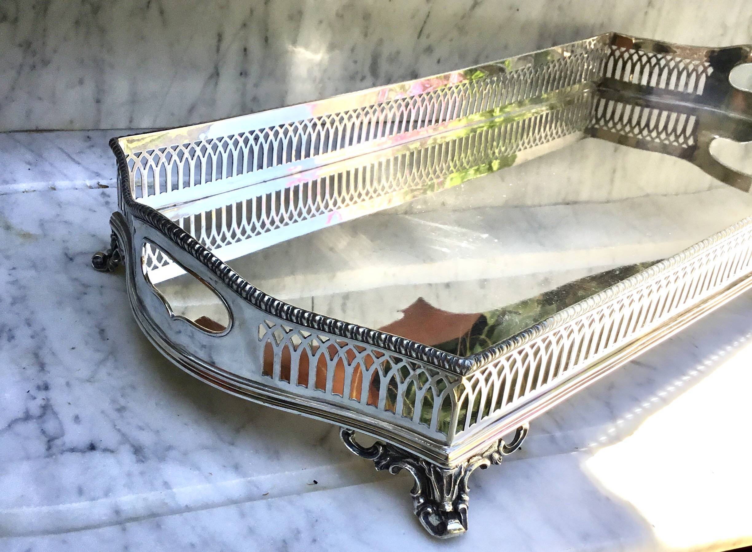 Important silver-plated metal table in the Louis XVI style.