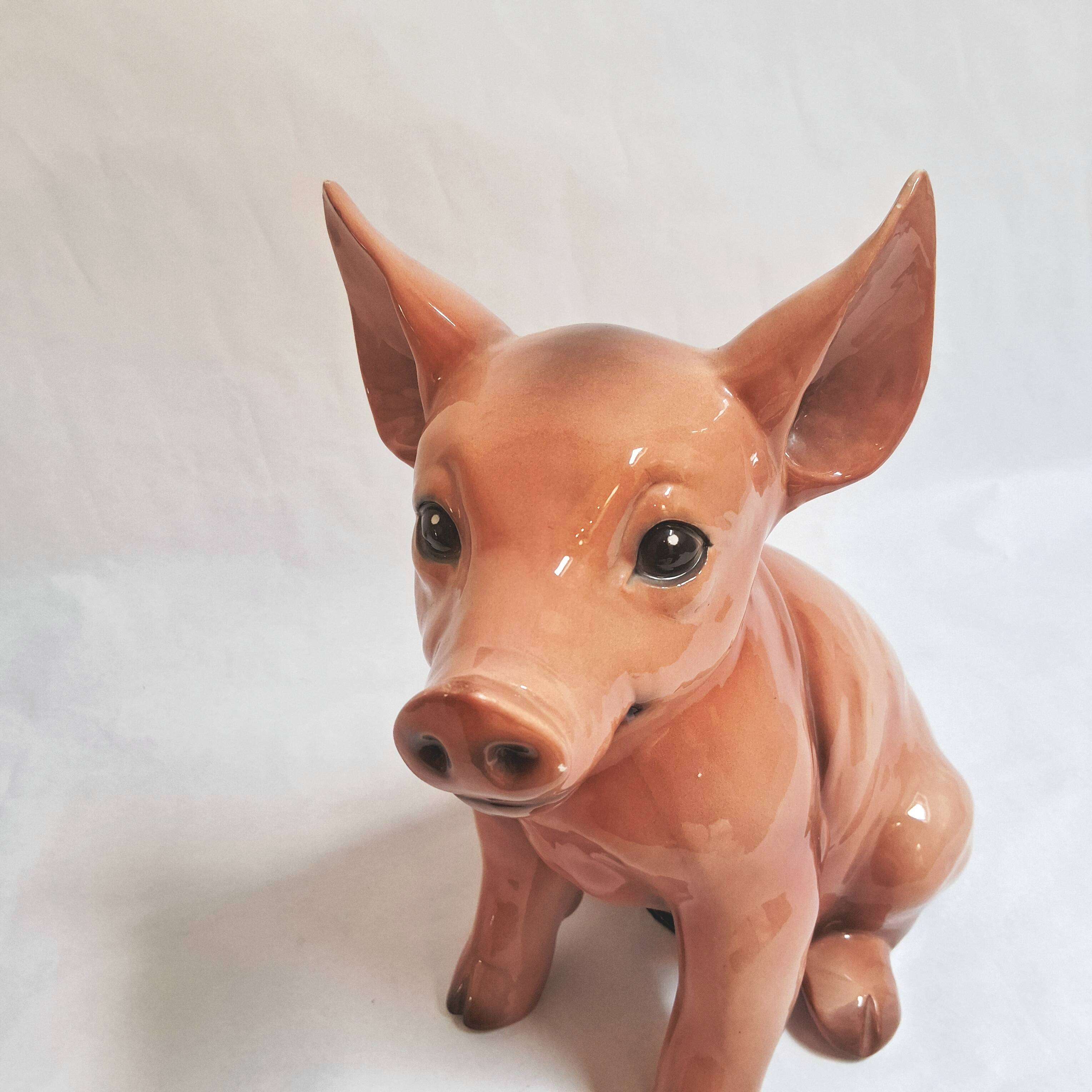 Beautiful, handcrafted porcelain figurine of a piglet, made by Capodimon.