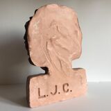 Bust old child in plaster stamped l.j.c.